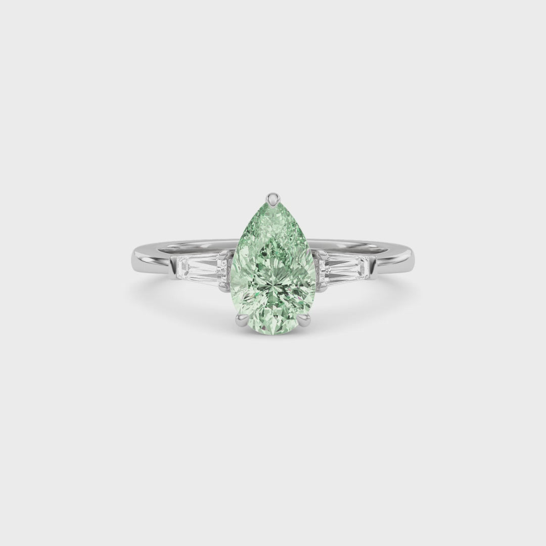 Platinum Three-Stone Fancy Green Pear Cut Diamond Ring with Tapered Baguette Side Stones