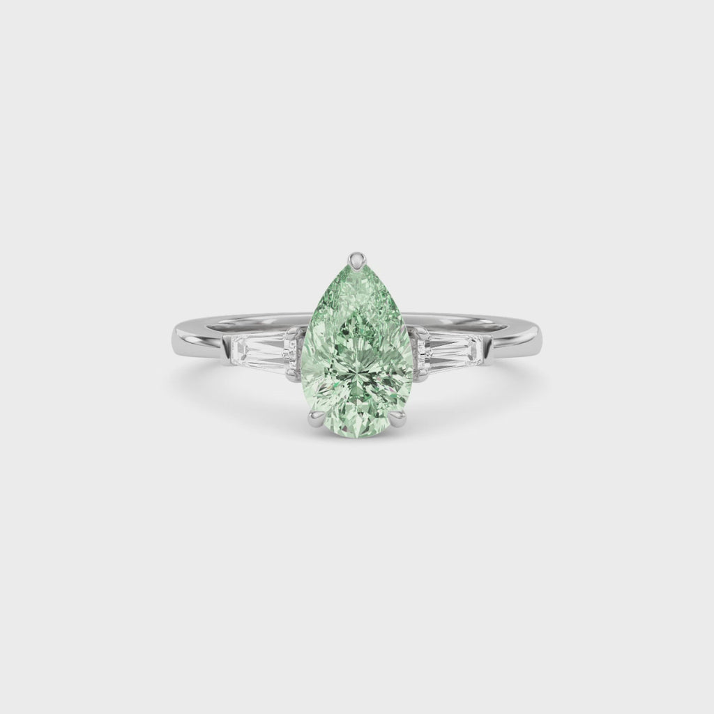 Platinum Three-Stone Fancy Green Pear Cut Diamond Ring with Tapered Baguette Side Stones