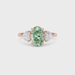 Rose gold Three-Stone Fancy Green Oval Cut Diamond Ring with Heart Side Stones