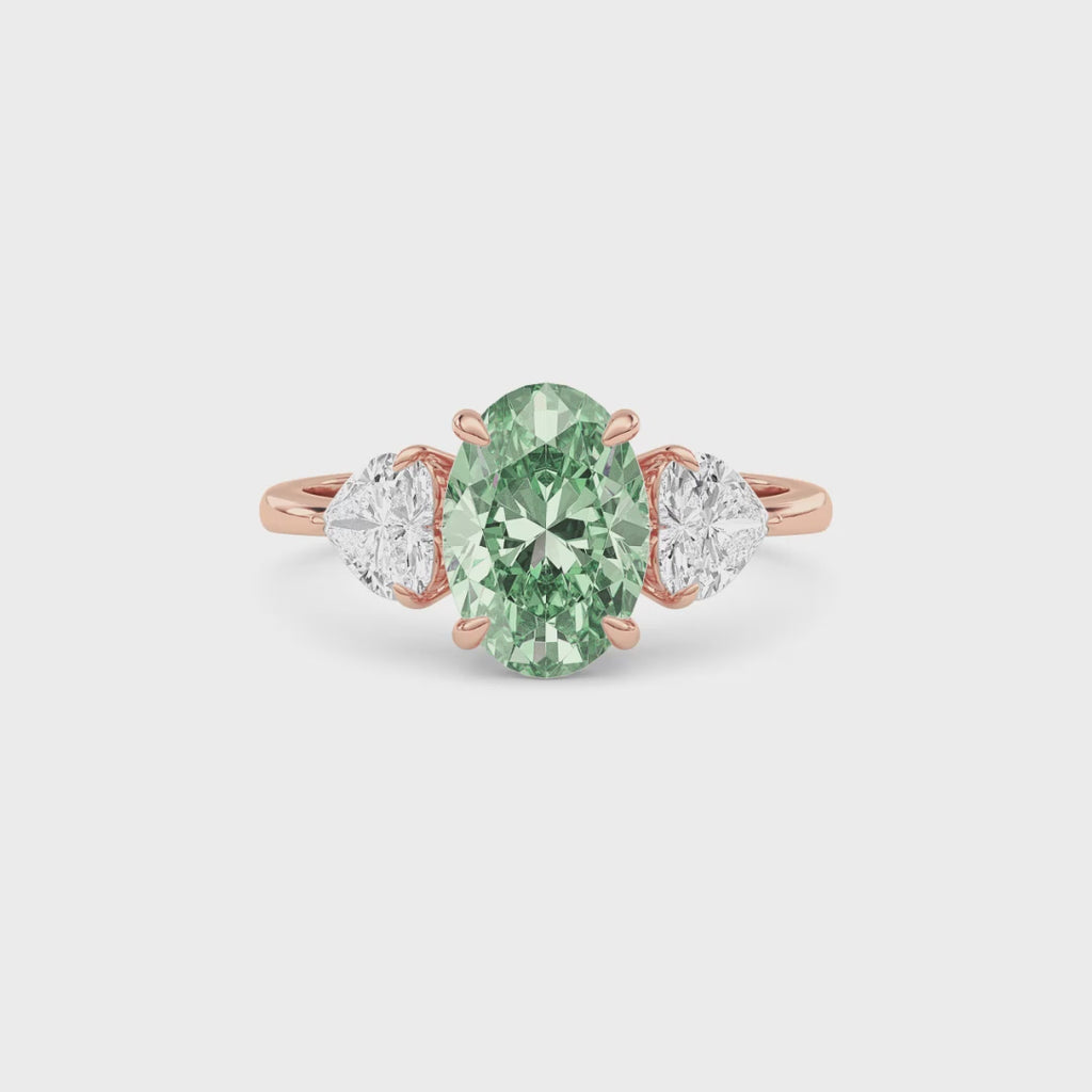 Rose gold Three-Stone Fancy Green Oval Cut Diamond Ring with Heart Side Stones