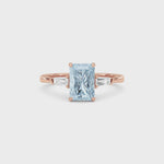 Rose gold Three-Stone Fancy Blue Radiant Cut Diamond Ring with Tapered Baguette Side Stones