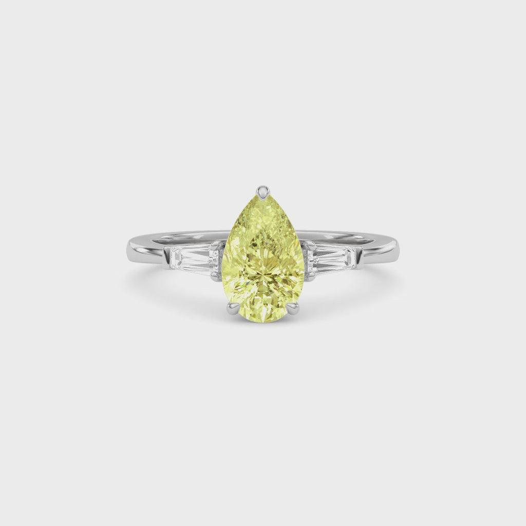 Yellow gold Three-Stone Fancy Yellow Pear Cut Diamond Ring with Tapered Baguette Side Stones