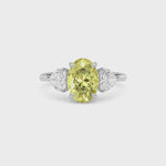 Yellow gold Three-Stone Fancy Yellow Oval Cut Diamond Ring with Heart Side Stones