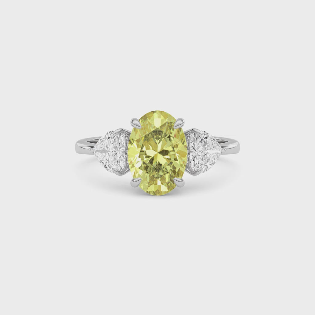 Yellow gold Three-Stone Fancy Yellow Oval Cut Diamond Ring with Heart Side Stones