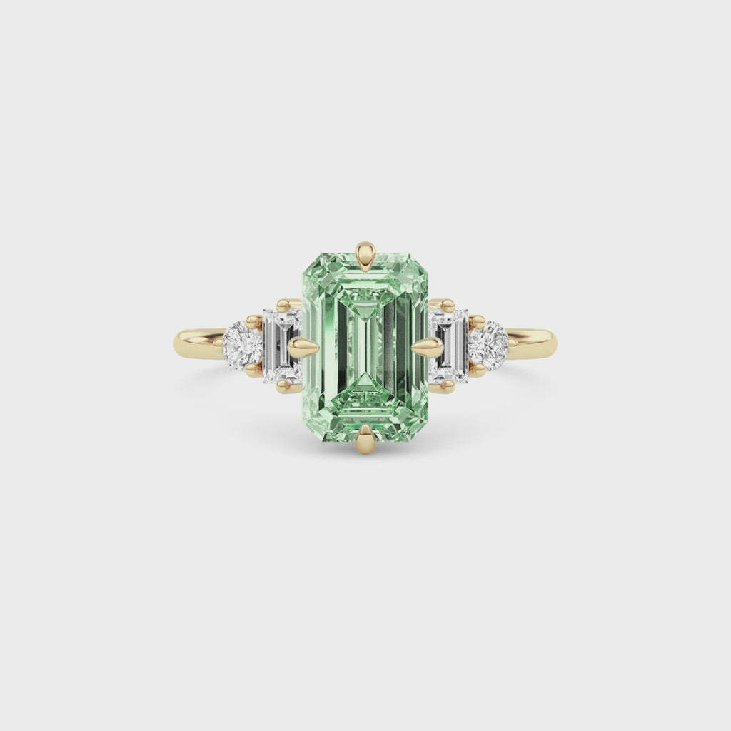 Yellow gold Three-Stone Fancy Green Emerald Cut Diamond Ring with Heart Side Stones