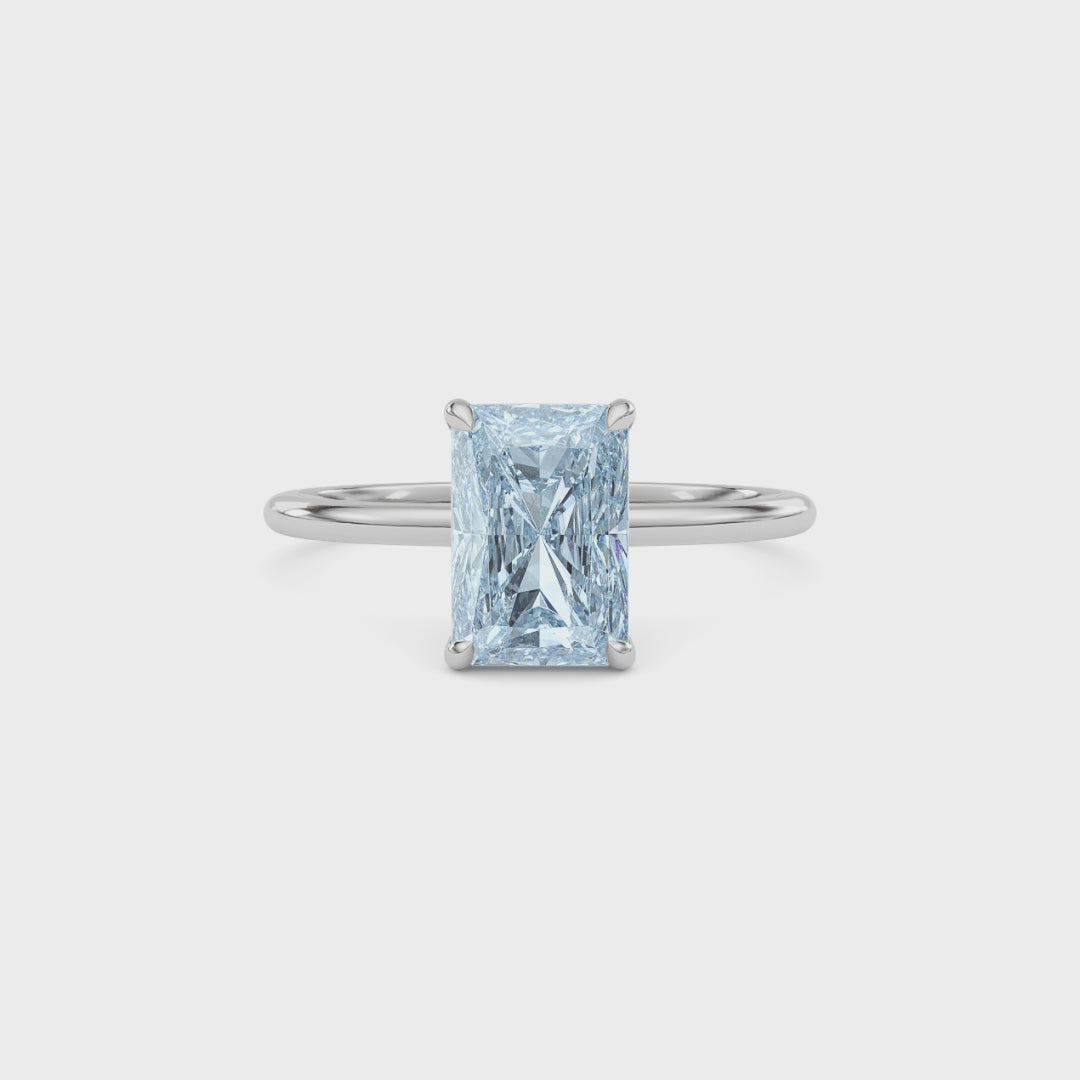 White gold Fancy Blue Radiant Cut Diamond Hidden Halo Solitaire Engagement Ring with Prong Setting