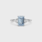 White gold Three-Stone Fancy Blue Emerald Cut Diamond Ring with Trillion Side Stones