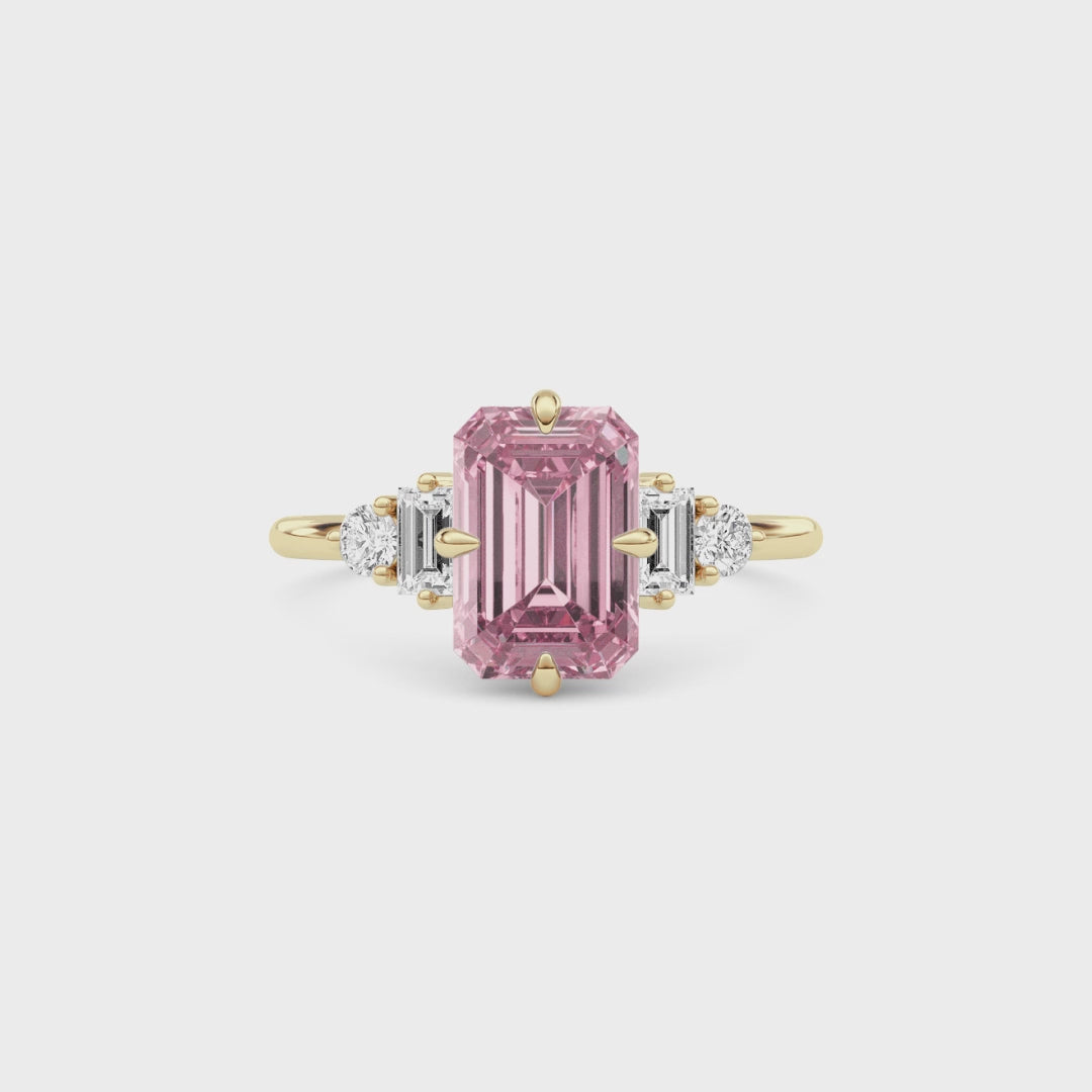 Yellow gold Fancy Pink Emerald Cut Three Stone Diamond Engagement Ring with Tapered Baguette and Round Side Stones