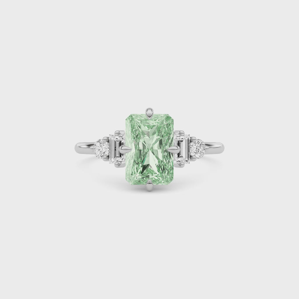 White gold Fancy Green Radiant Cut Three Stone Diamond Engagement Ring with Tapered Baguette and Round Side Stones