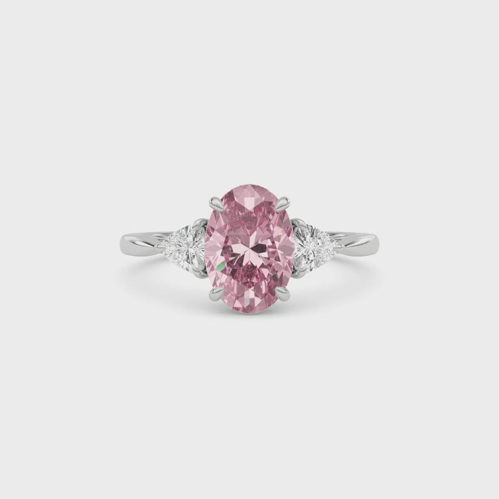 White gold Three-Stone Fancy Pink Oval Cut Diamond Ring with Trillion Side Stones