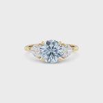 Yellow gold Three-Stone Fancy Blue Round Cut Diamond Ring with Heart Side Stones