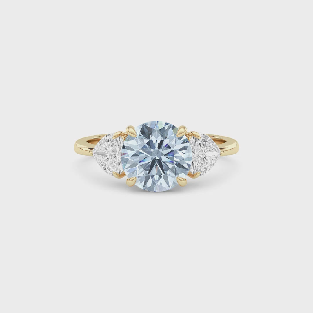 Yellow gold Three-Stone Fancy Blue Round Cut Diamond Ring with Heart Side Stones