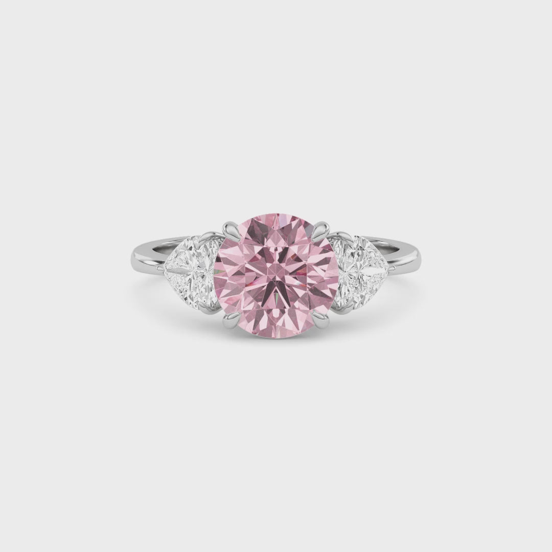 Platinum Three-Stone Fancy Pink Round Cut Diamond Ring with Heart Side Stones