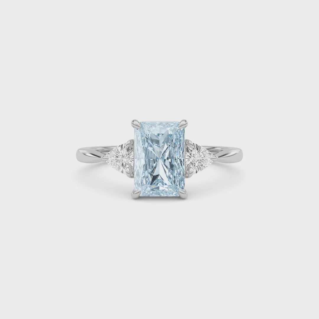 Platinum Three-Stone Fancy Blue Radiant Cut Diamond Ring with Trillion Side Stones
