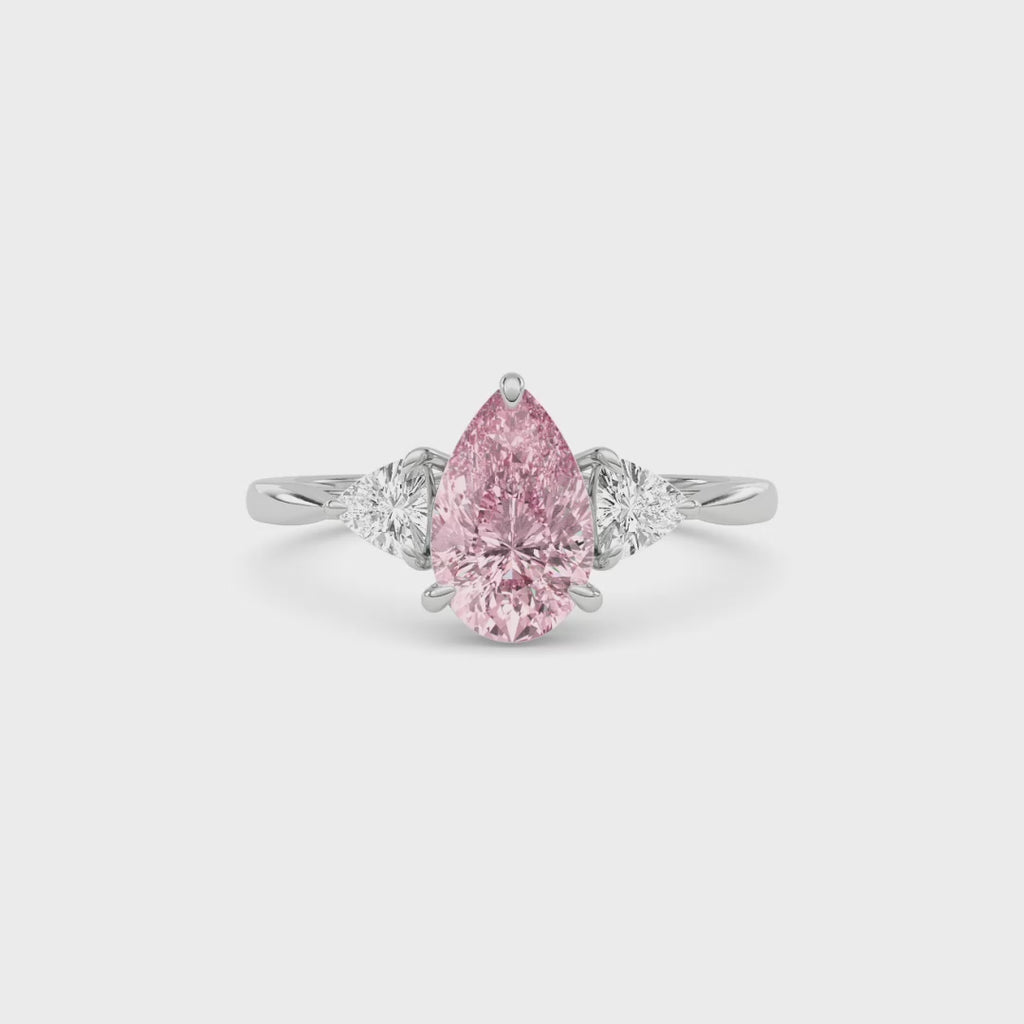 Silver Three-Stone Fancy Pink Pear Cut Diamond Ring with Trillion Side Stones