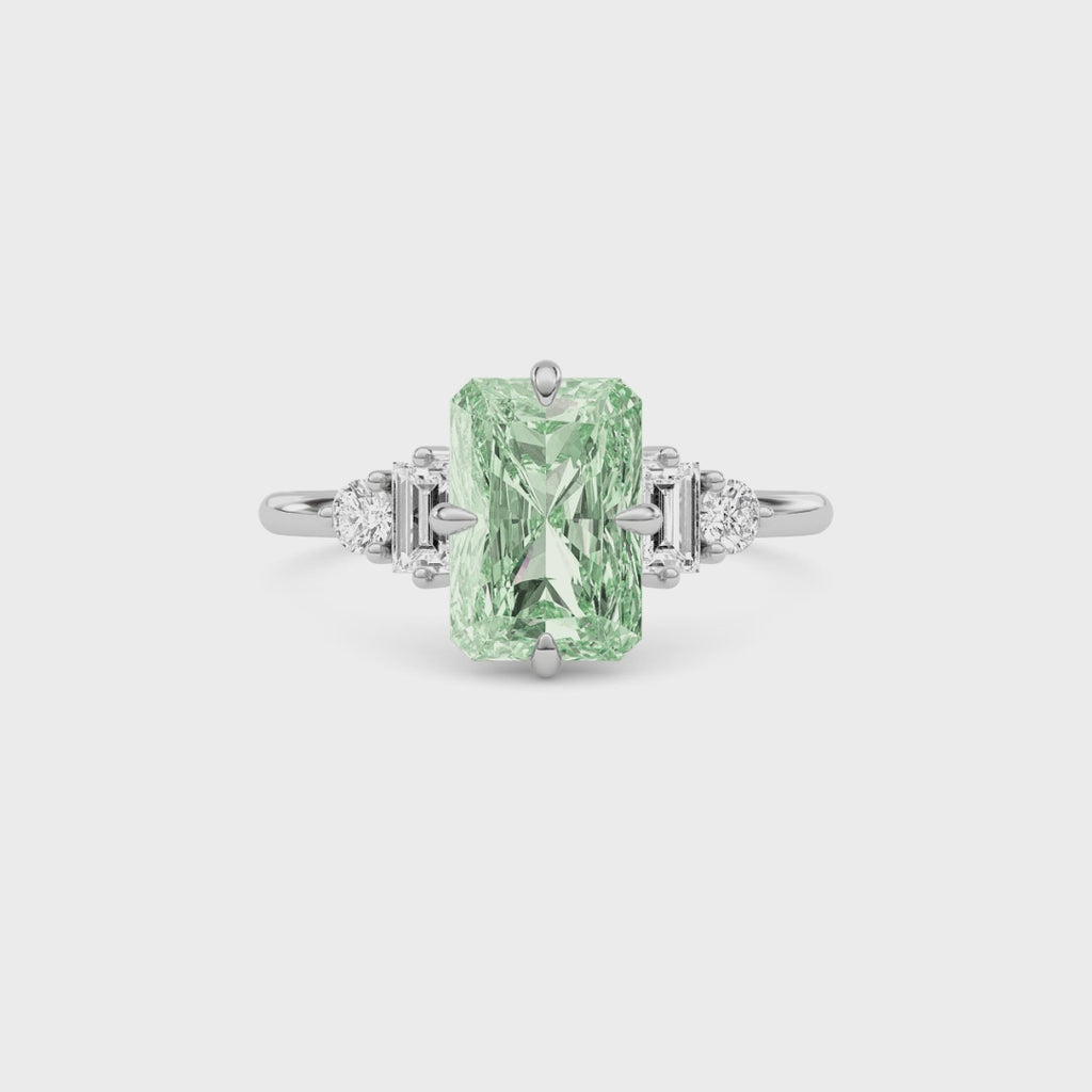 White gold Three-Stone Fancy Green Radiant Cut Diamond Ring with Heart Side Stones