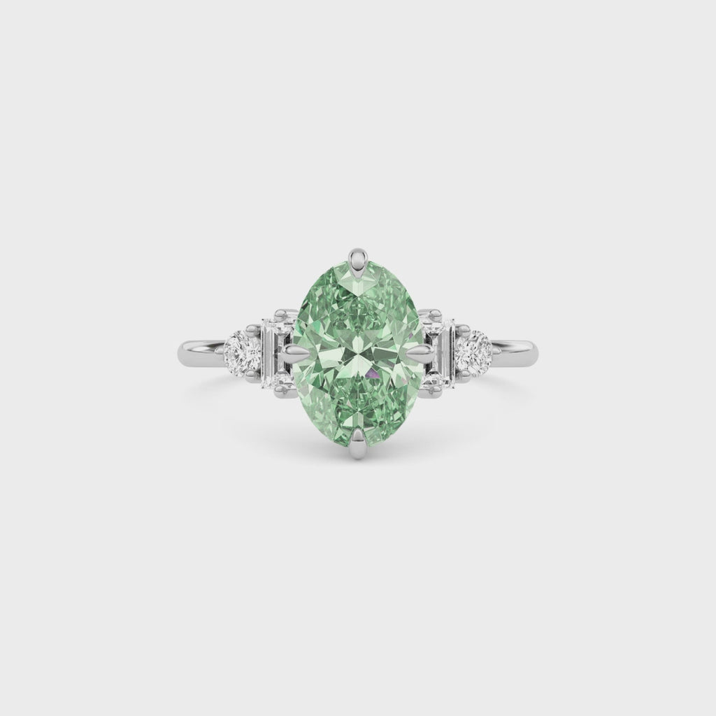 White gold Fancy Green Oval Cut Three Stone Diamond Engagement Ring with Tapered Baguette and Round Side Stones