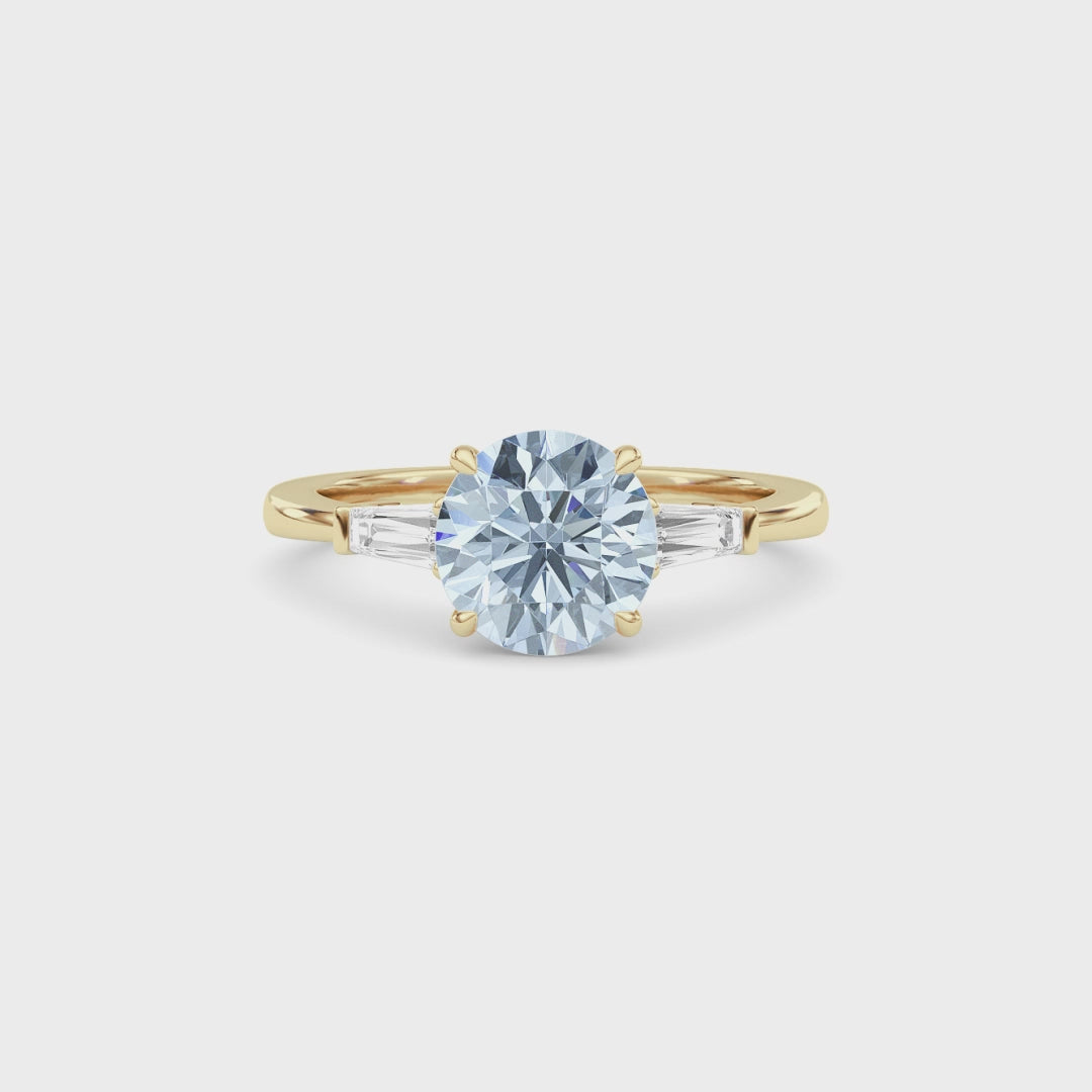 Yellow gold Three-Stone Fancy Blue Round Cut Diamond Ring with Tapered Baguette Side Stones