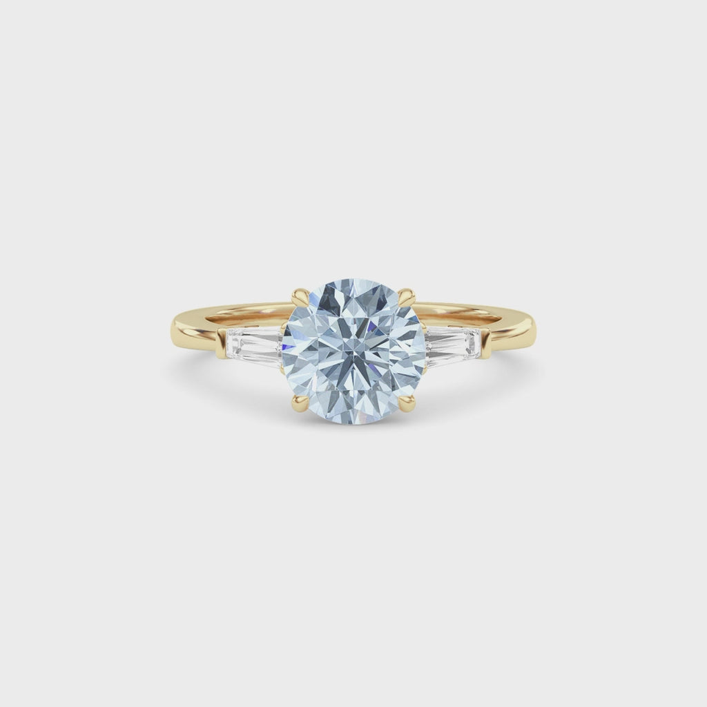 Yellow gold Three-Stone Fancy Blue Round Cut Diamond Ring with Tapered Baguette Side Stones
