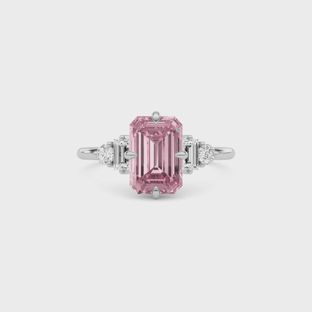 White gold Fancy Pink Emerald Cut Three Stone Diamond Engagement Ring with Tapered Baguette and Round Side Stones