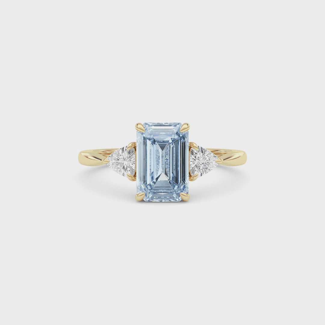 Yellow gold Three-Stone Fancy Blue Emerald Cut Diamond Ring with Trillion Side Stones