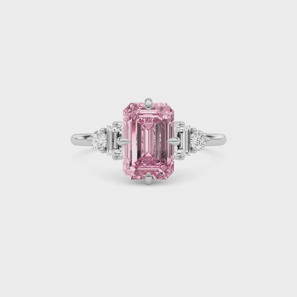 White gold Three-Stone Fancy Pink Emerald Cut Diamond Ring with Heart Side Stones