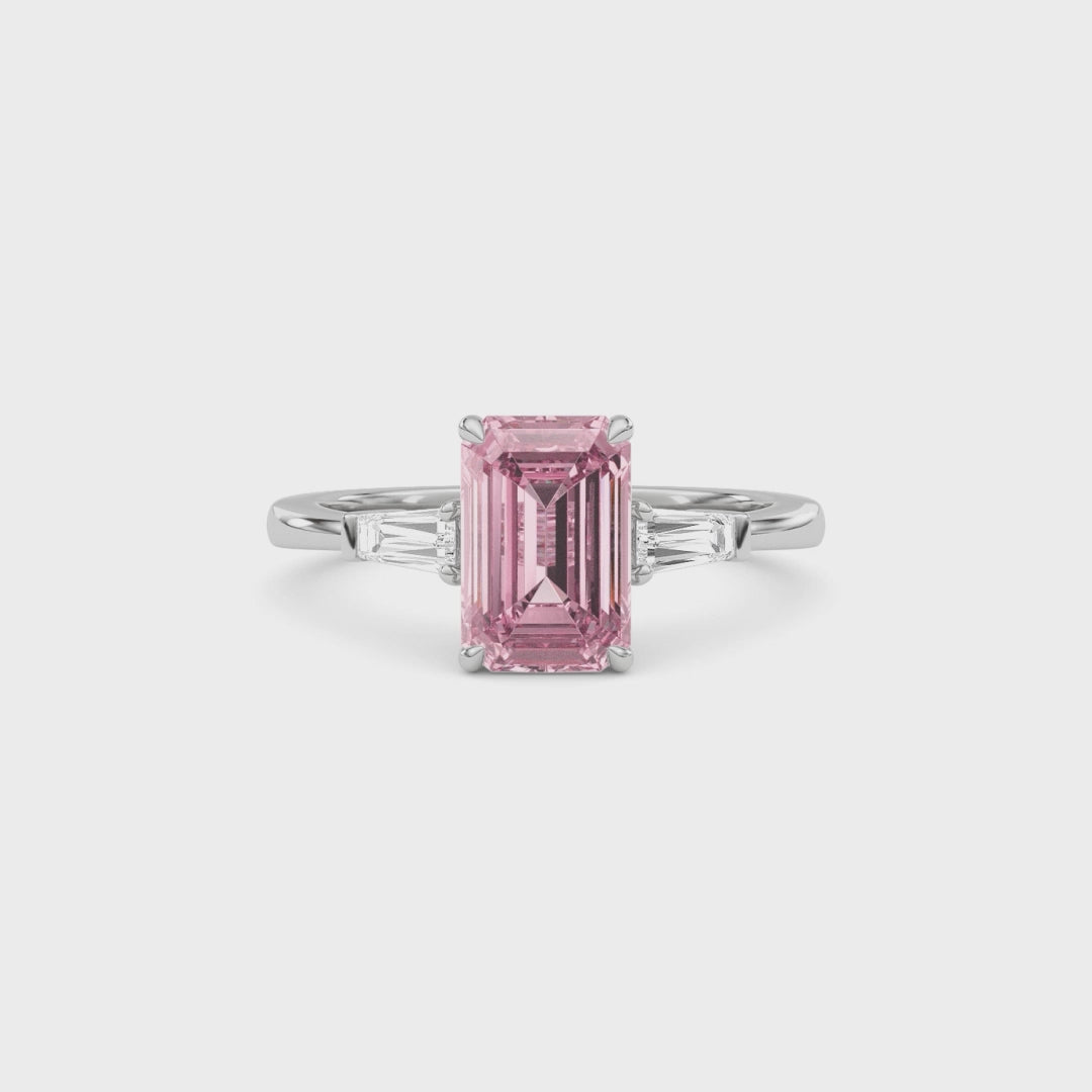 Platinum Three-Stone Fancy Pink Emerald Cut Diamond Ring with Tapered Baguette Side Stones