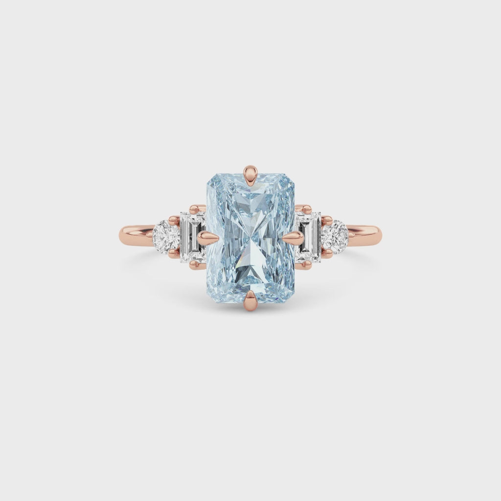 Rose gold Three-Stone Fancy Blue Radiant Cut Diamond Ring with Heart Side Stones