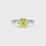 Yellow gold Three-Stone Fancy Yellow Round Cut Diamond Ring with Tapered Baguette Side Stones