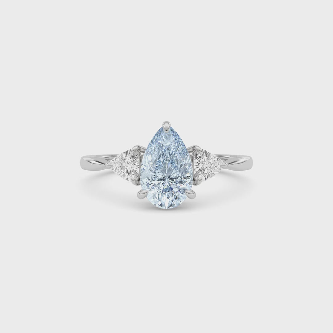 White gold Three-Stone Fancy Blue Pear Cut Diamond Ring with Trillion Side Stones