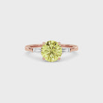 Rose gold Three-Stone Fancy Yellow Round Cut Diamond Ring with Tapered Baguette Side Stones