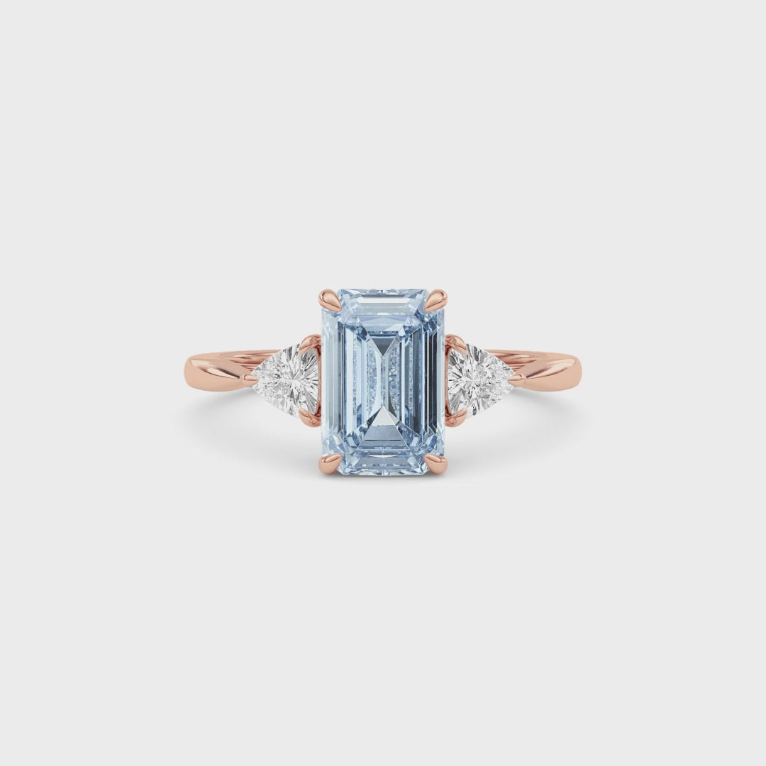 Rose gold Three-Stone Fancy Blue Emerald Cut Diamond Ring with Trillion Side Stones