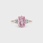 Rose gold Fancy Pink Radiant Cut Three Stone Diamond Engagement Ring with Tapered Baguette and Round Side Stones