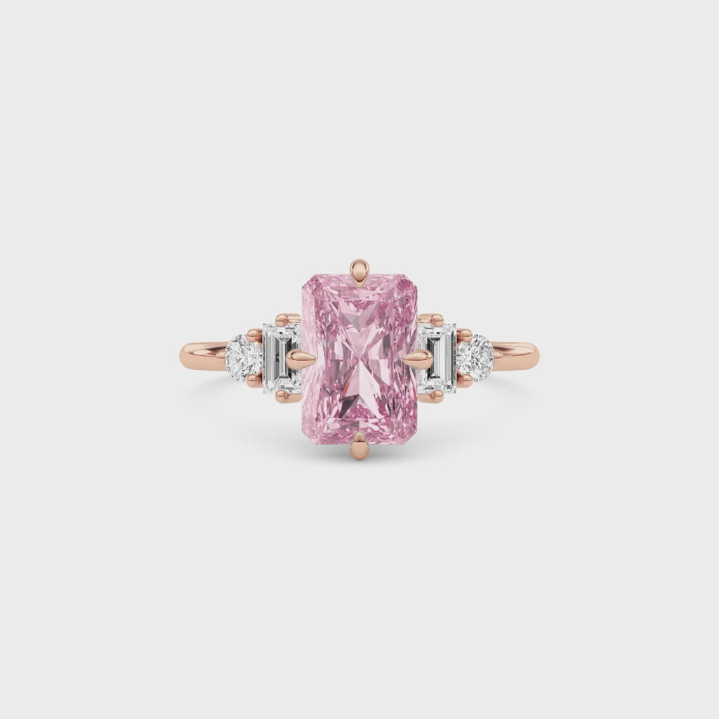 Rose gold Fancy Pink Radiant Cut Three Stone Diamond Engagement Ring with Tapered Baguette and Round Side Stones