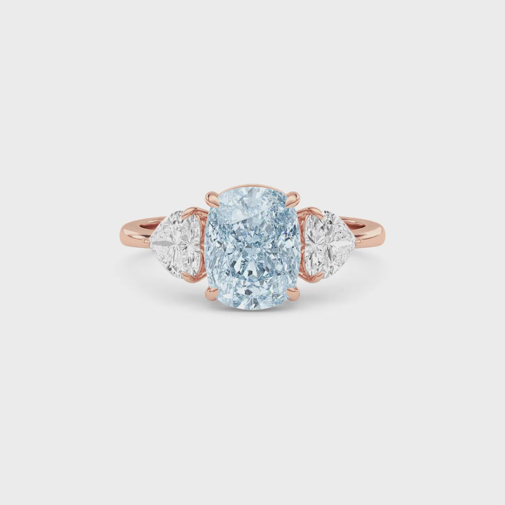 Rose gold Three-Stone Fancy Blue Cushion Cut Diamond Ring with Heart Side Stones