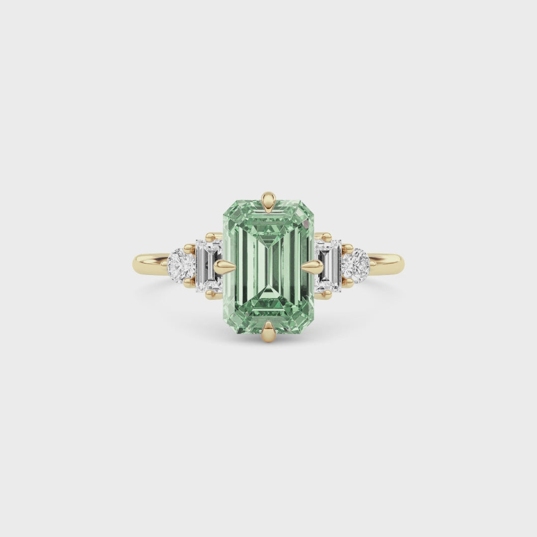 Yellow gold Fancy Green Emerald Cut Three Stone Diamond Engagement Ring with Tapered Baguette and Round Side Stones