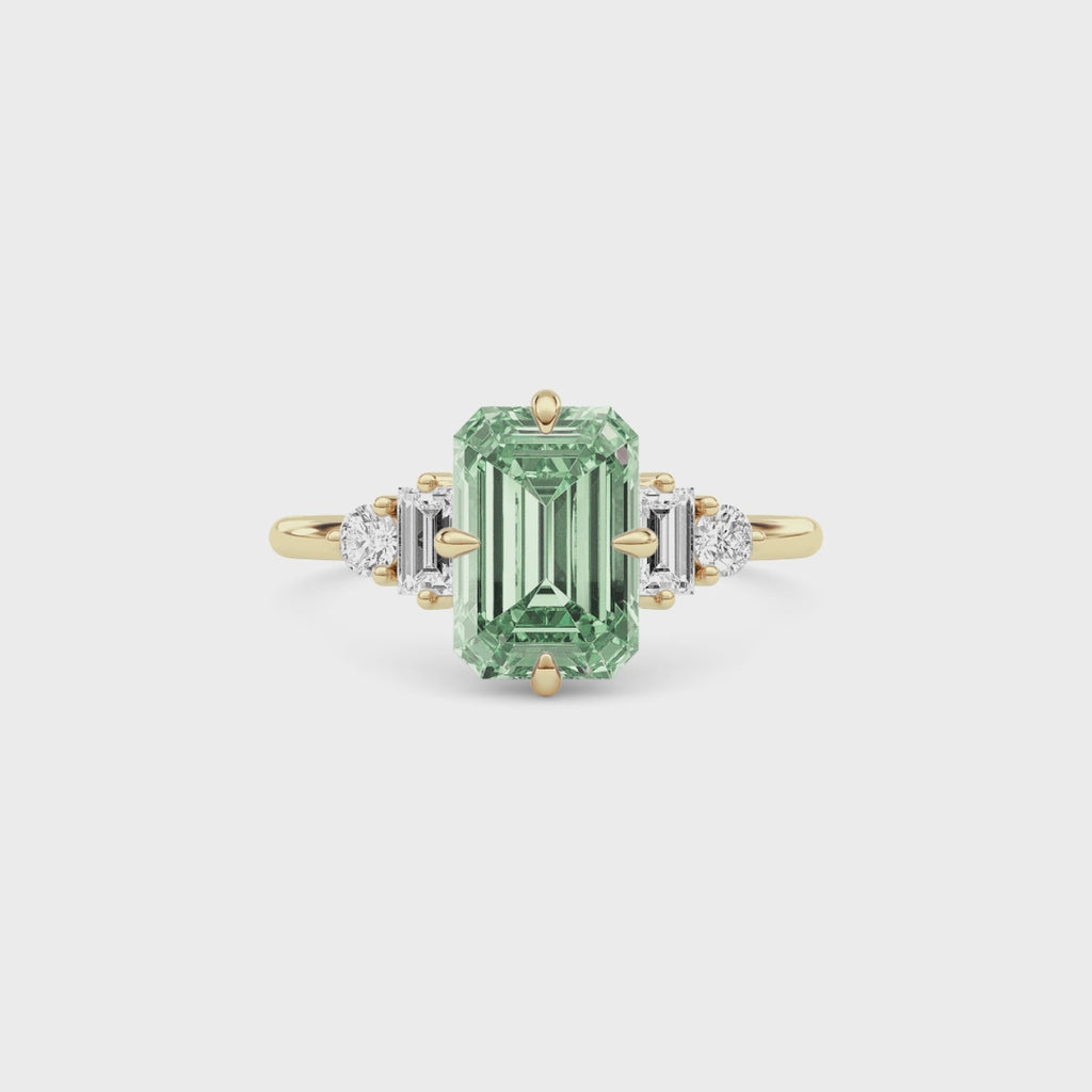 Yellow gold Fancy Green Emerald Cut Three Stone Diamond Engagement Ring with Tapered Baguette and Round Side Stones