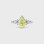 Yellow gold Fancy Yellow Pear Cut Three Stone Diamond Engagement Ring with Tapered Baguette and Round Side Stones