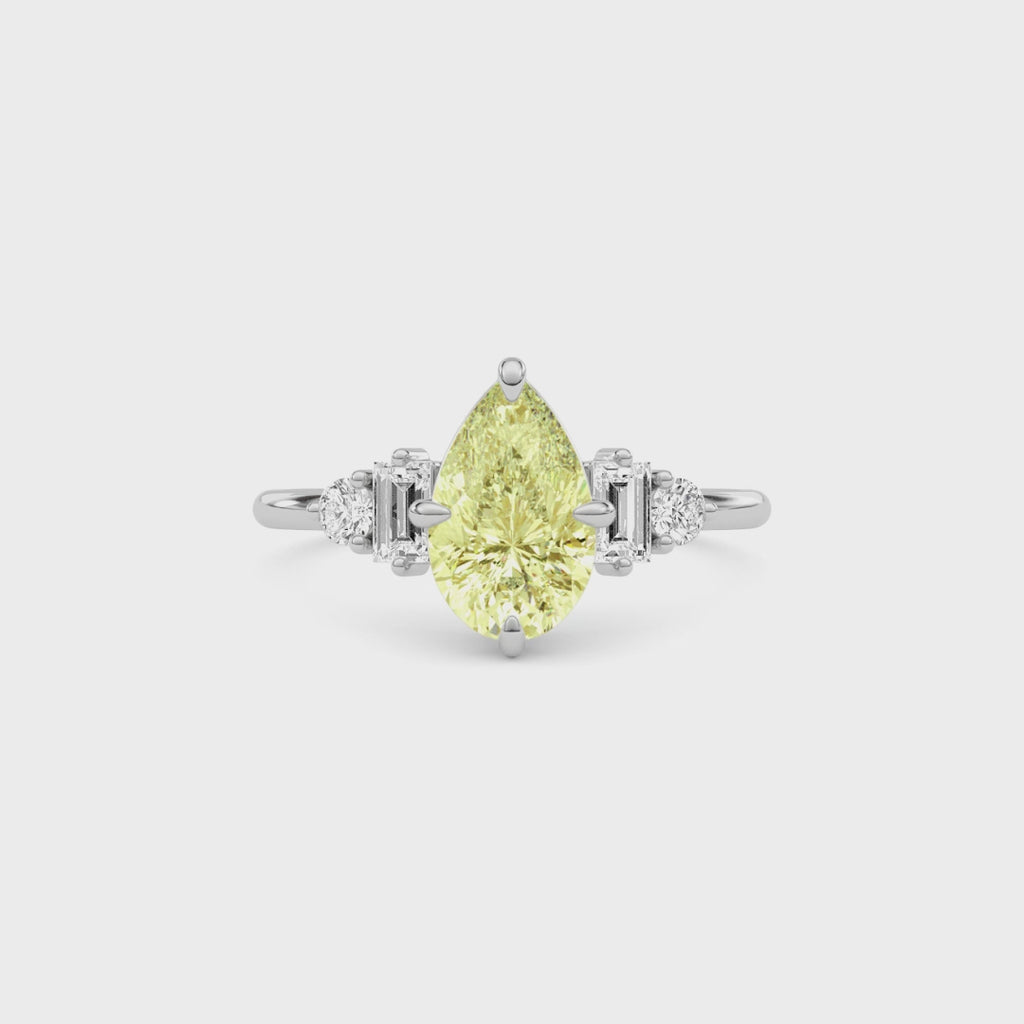 Yellow gold Fancy Yellow Pear Cut Three Stone Diamond Engagement Ring with Tapered Baguette and Round Side Stones