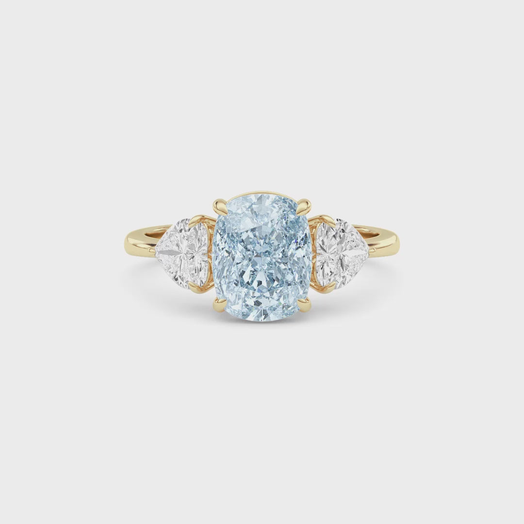 Yellow gold Three-Stone Fancy Blue Cushion Cut Diamond Ring with Heart Side Stones