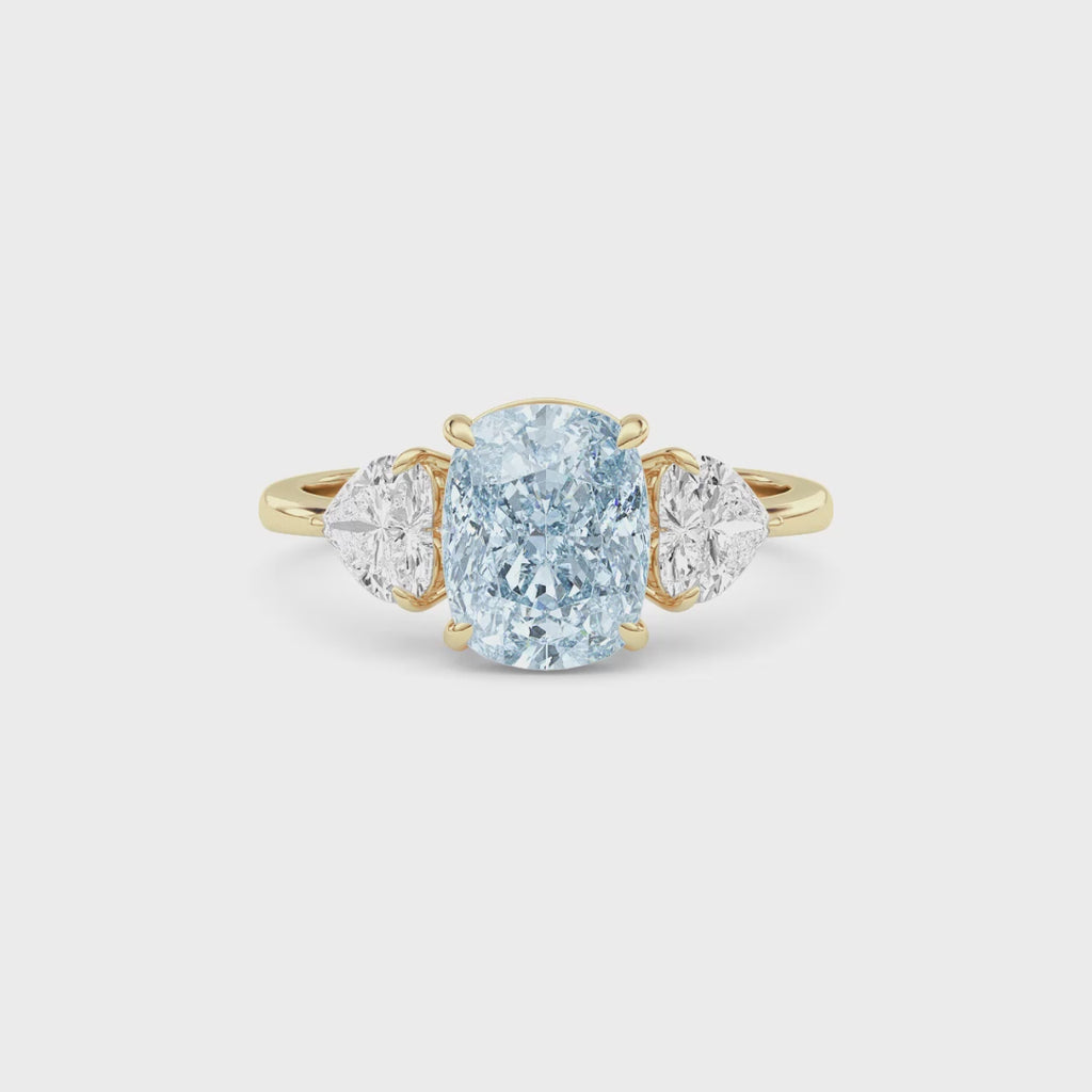 Yellow gold Three-Stone Fancy Blue Cushion Cut Diamond Ring with Heart Side Stones