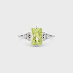 Yellow gold Fancy Yellow Radiant Cut Three Stone Diamond Engagement Ring with Tapered Baguette and Round Side Stones