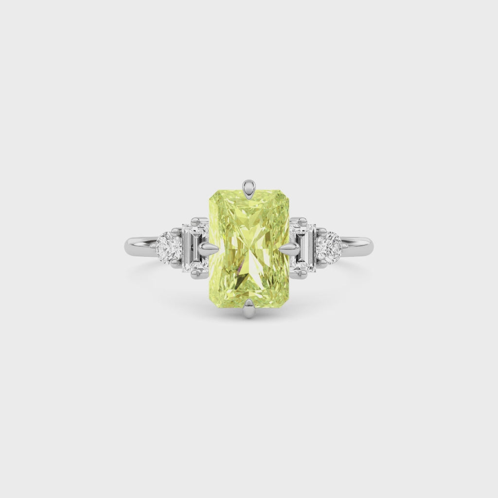 Yellow gold Fancy Yellow Radiant Cut Three Stone Diamond Engagement Ring with Tapered Baguette and Round Side Stones