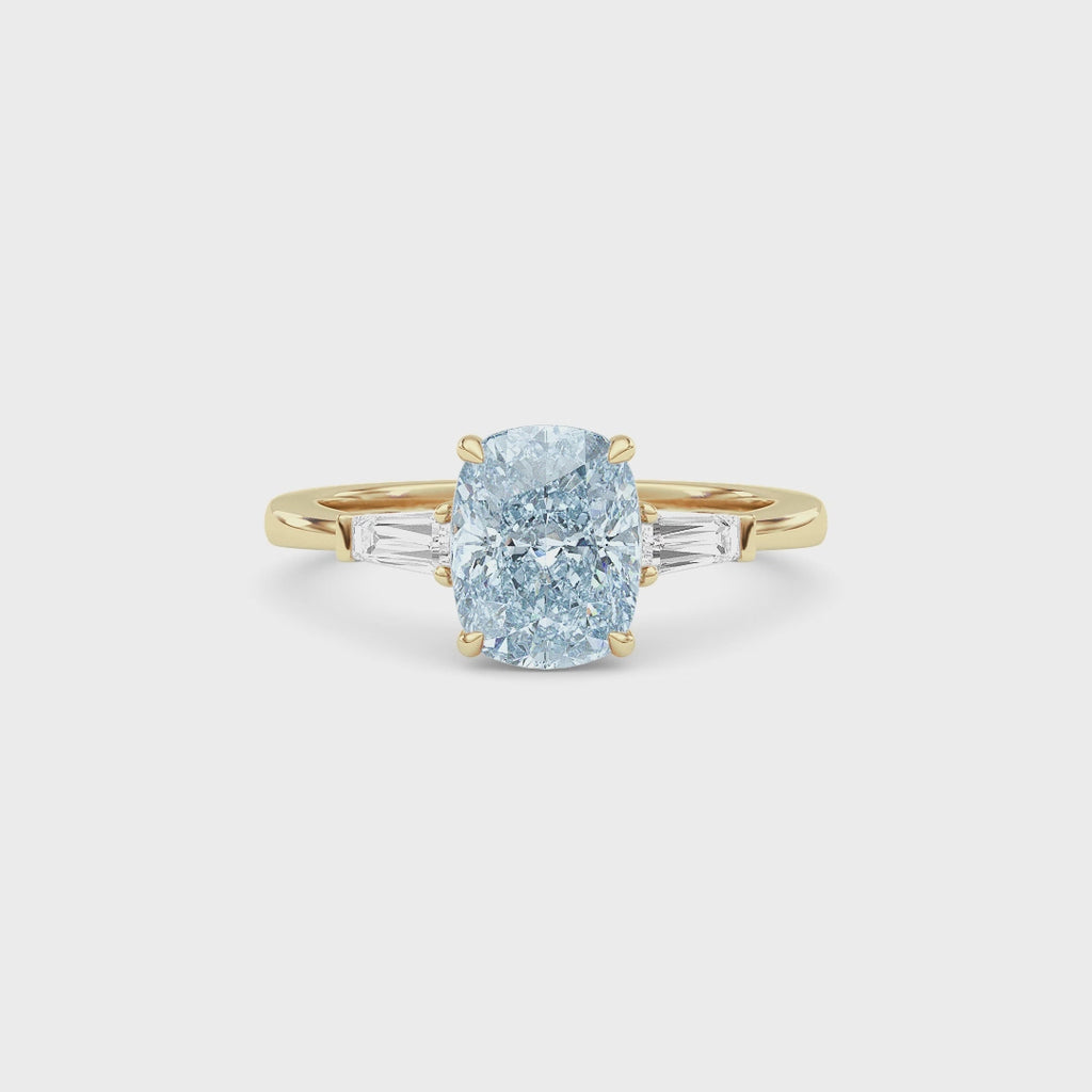 Yellow gold Three-Stone Fancy Blue Cushion Cut Diamond Ring with Tapered Baguette Side Stones