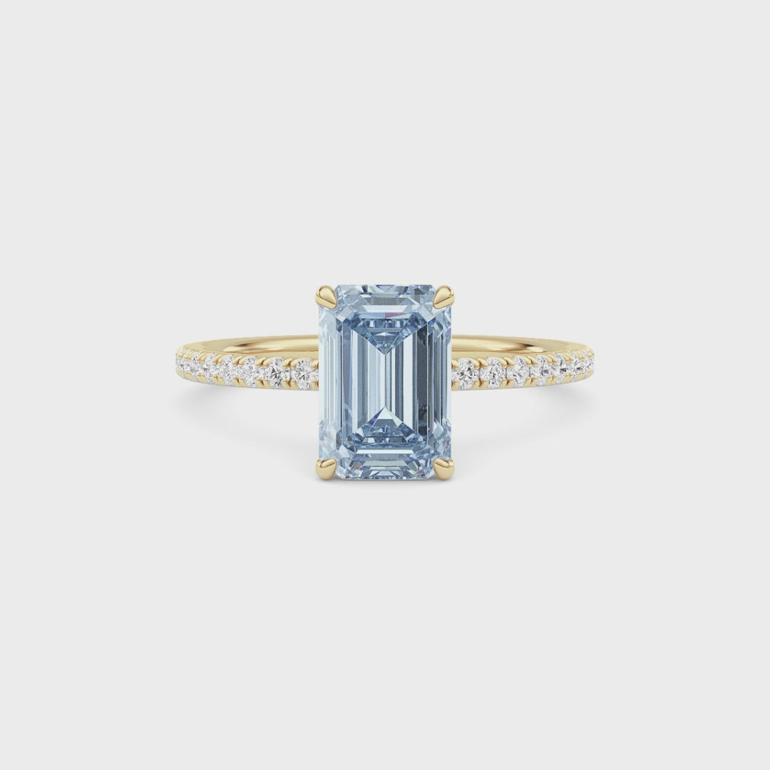 Yellow gold Fancy Blue Emerald Cut Diamond Solitaire with Pavé Band