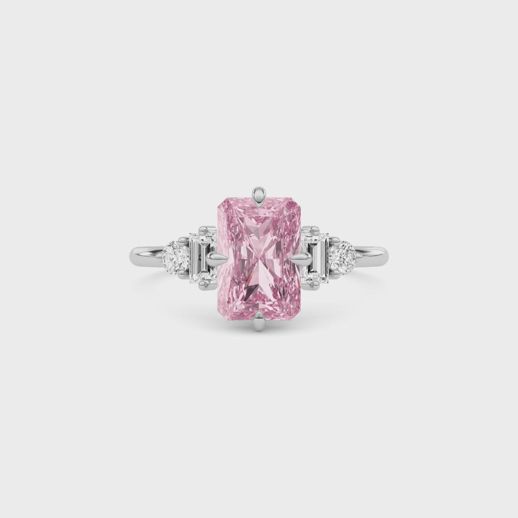 Platinum Fancy Pink Radiant Cut Three Stone Diamond Engagement Ring with Tapered Baguette and Round Side Stones