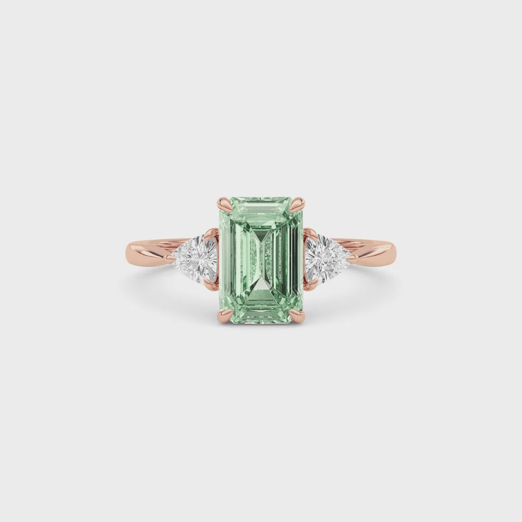 Rose gold Three-Stone Fancy Green Emerald Cut Diamond Ring with Trillion Side Stones