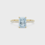 Yellow gold Fancy Blue Radiant Cut Diamond Solitaire with Pavé Band