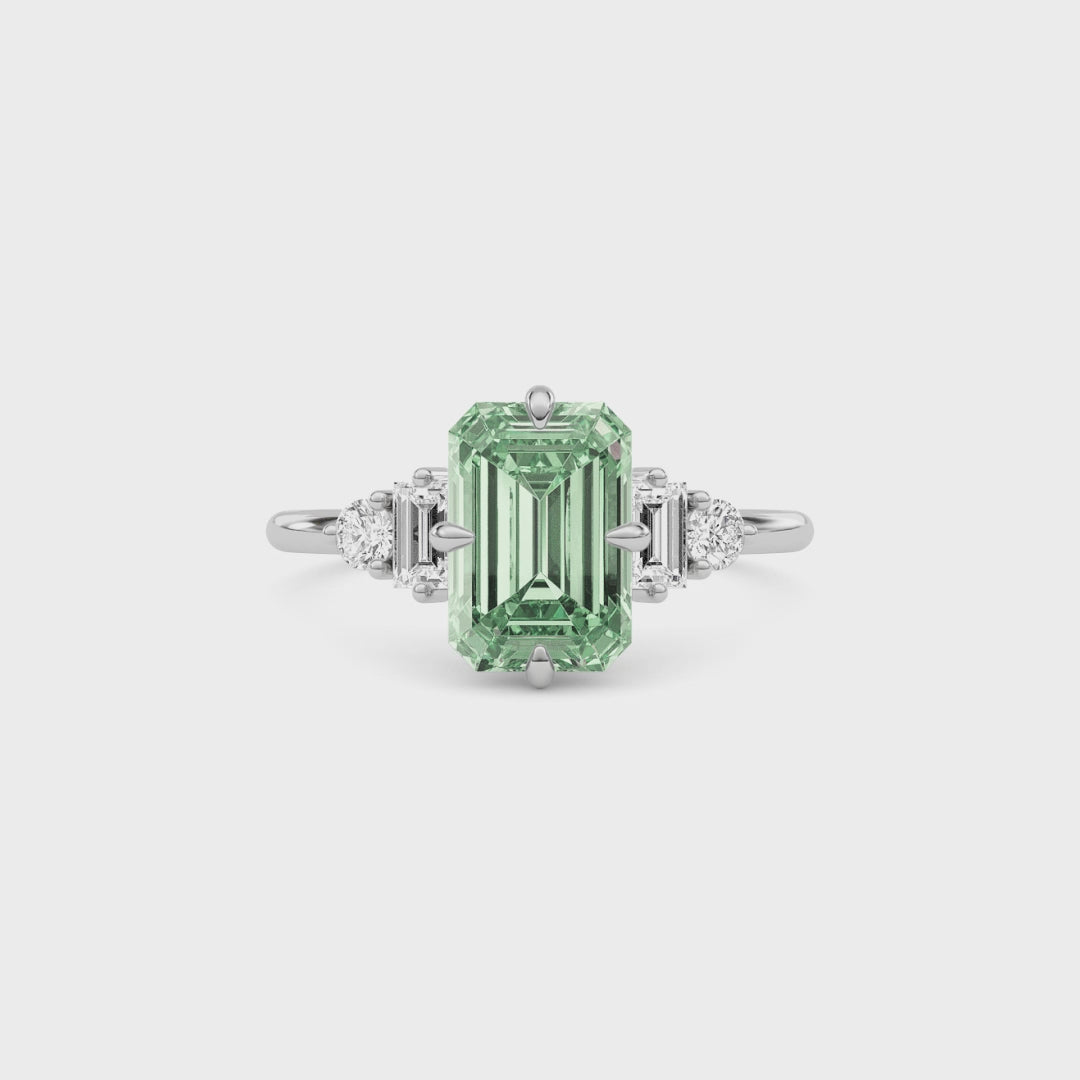 Platinum Fancy Green Emerald Cut Three Stone Diamond Engagement Ring with Tapered Baguette and Round Side Stones
