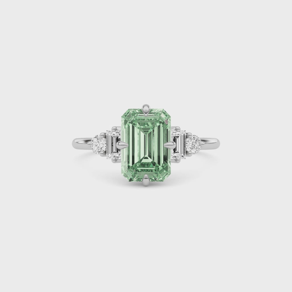 Platinum Fancy Green Emerald Cut Three Stone Diamond Engagement Ring with Tapered Baguette and Round Side Stones